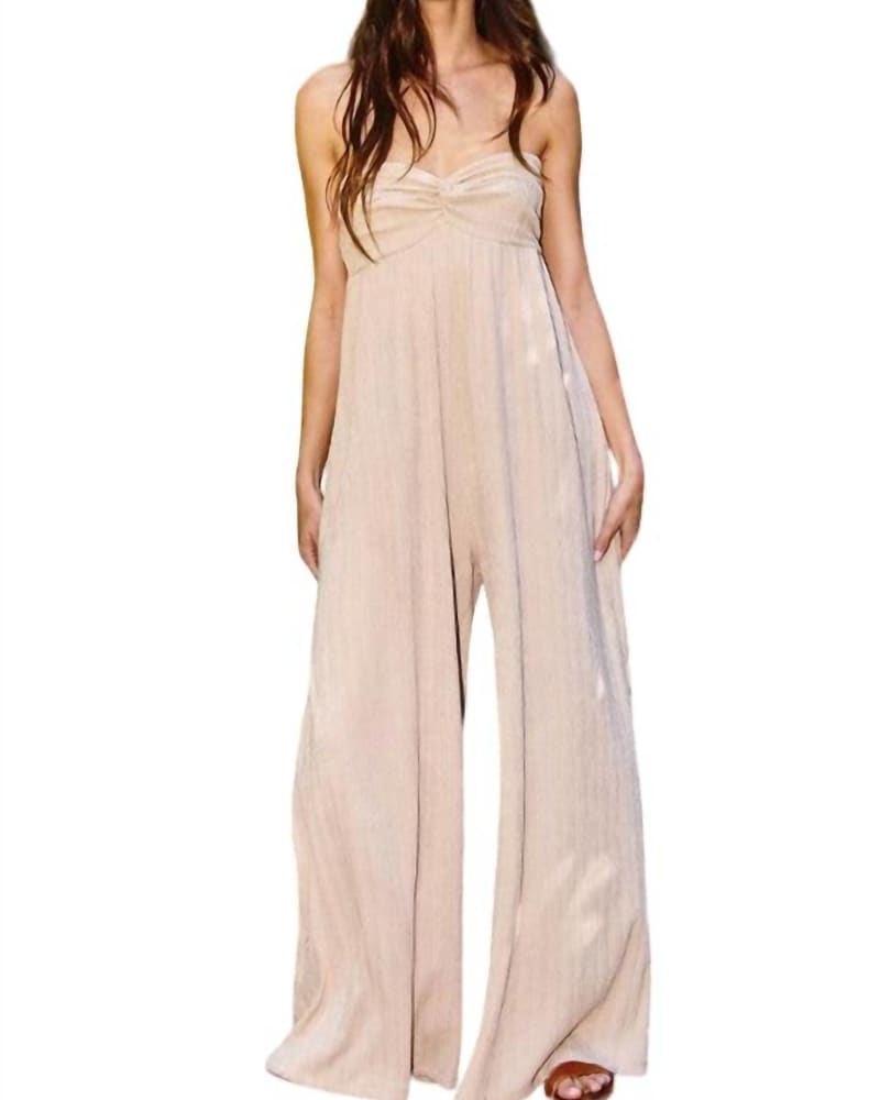 Front of a model wearing a size Large Easy Breezy Jumpsuit In Taupe in Taupe by BUCKETLIST. | dia_product_style_image_id:347589